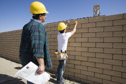 man installing retaining walls